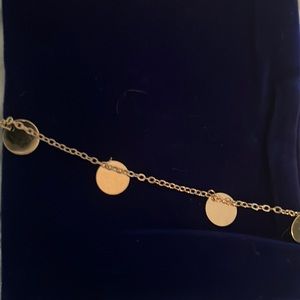 Gold colored anklet